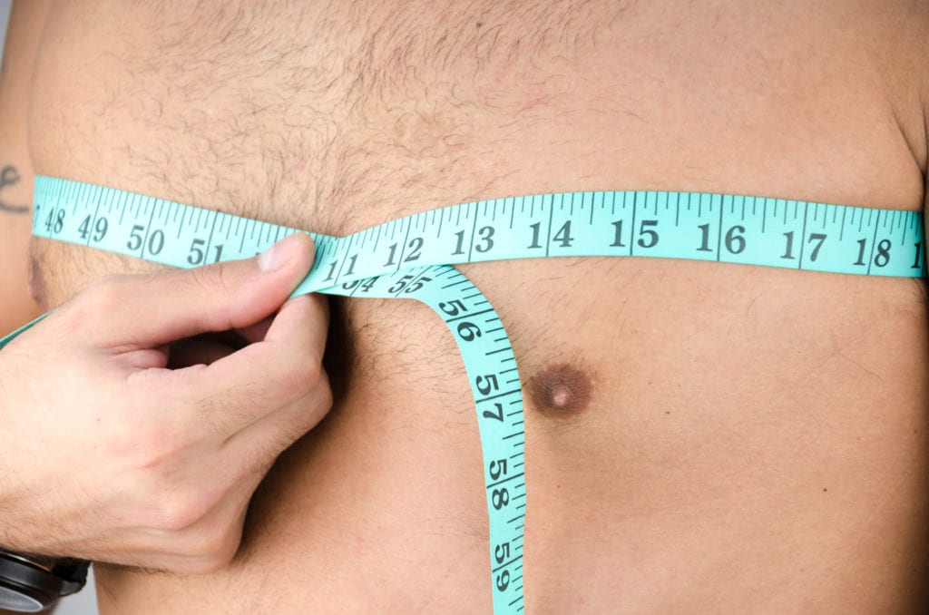 Man measuring his chest