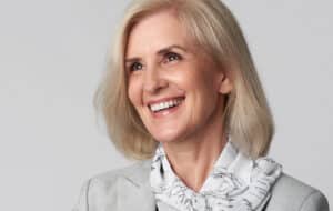 Woman in her 50s has a rejuvenated, natural-looking face thanks to modern surgery techniques.